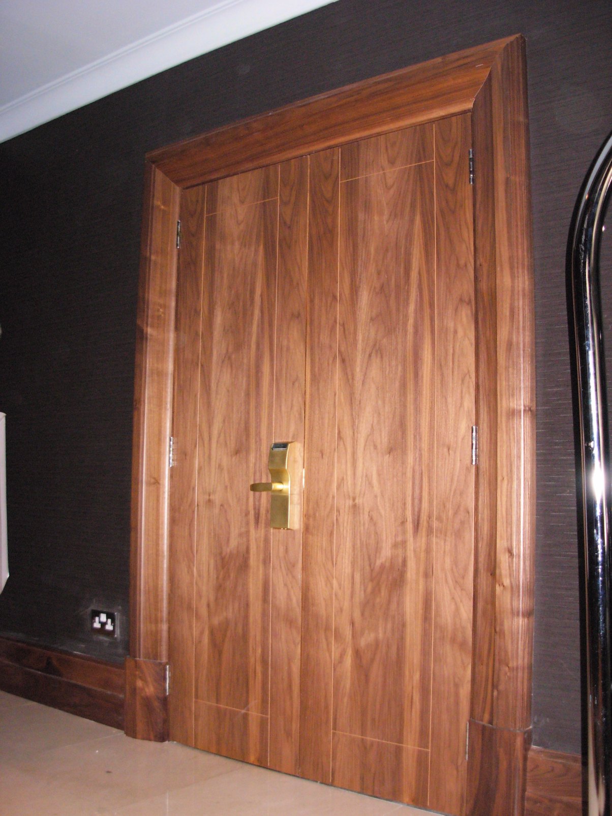 Walnut double door hung with a matching frame